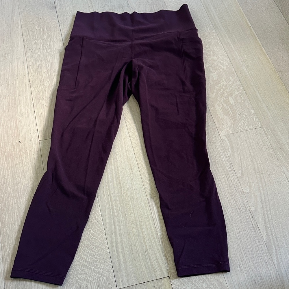 Athleta salutation stash pocket II 7/8 tight